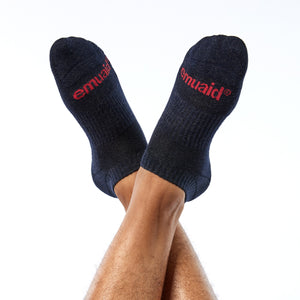 Una foto de Emuaid Ionic Silver Socks with red logo worn by model