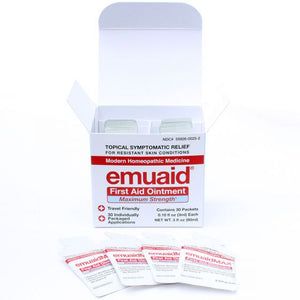 Esta es una foto de un paquete de viaje de 30 días de pomada de primeros auxilios de EMUAIDMAX® abierto.
